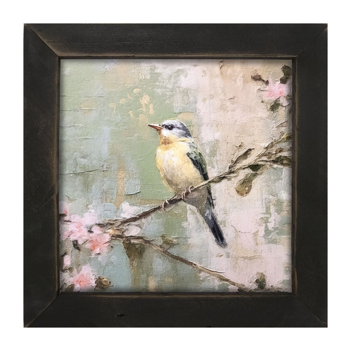Bird sitting on cherry blossom branch