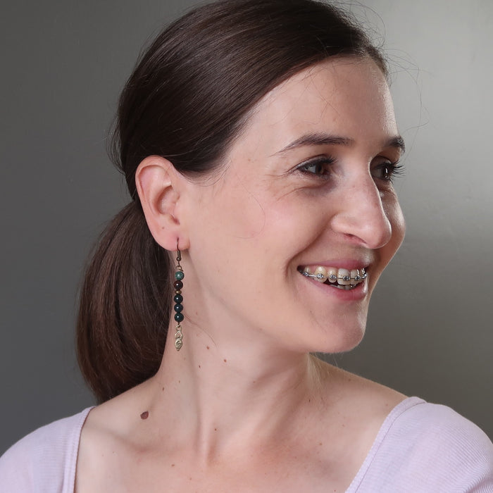 female model wearing bloodstone goddess dangle earrings