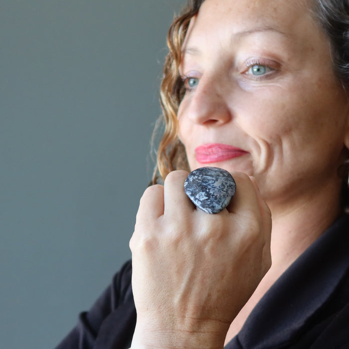 female wearing a big dendritic jasper ring