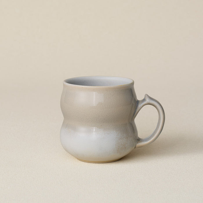Hand-thrown ceramic mug by Rookwood Pottery