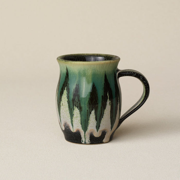 Hand-thrown ceramic mug by Rookwood Pottery