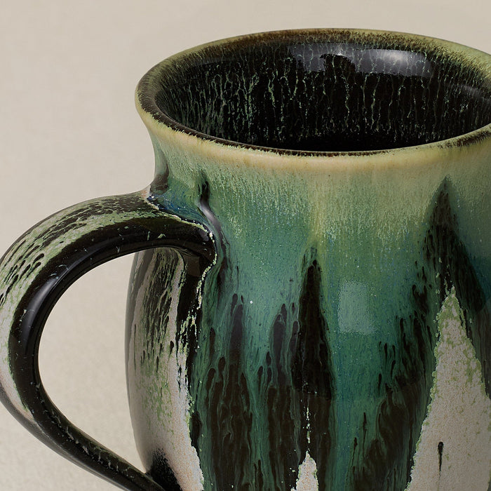 Close-up details of hand-thrown mug by Rookwood
