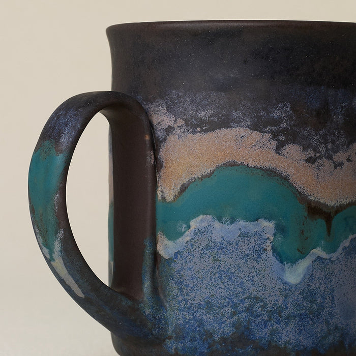 Close-up details of hand-thrown mug by Rookwood