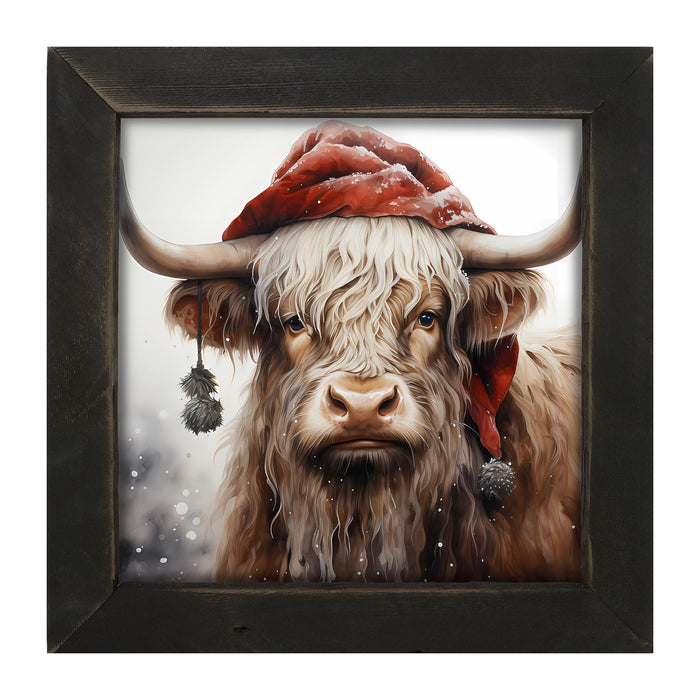 Highland cow with Santa hat