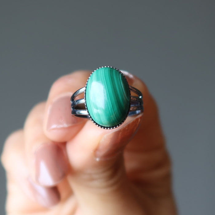 hand holding malachite ring