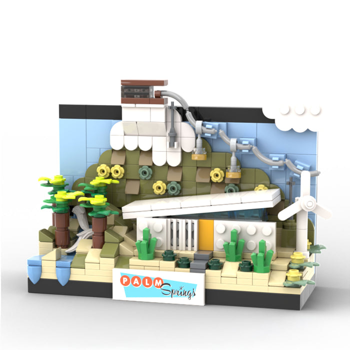 Model of a building with palm trees and 'Palm Springs' sign made from interlocking bricks on a white background