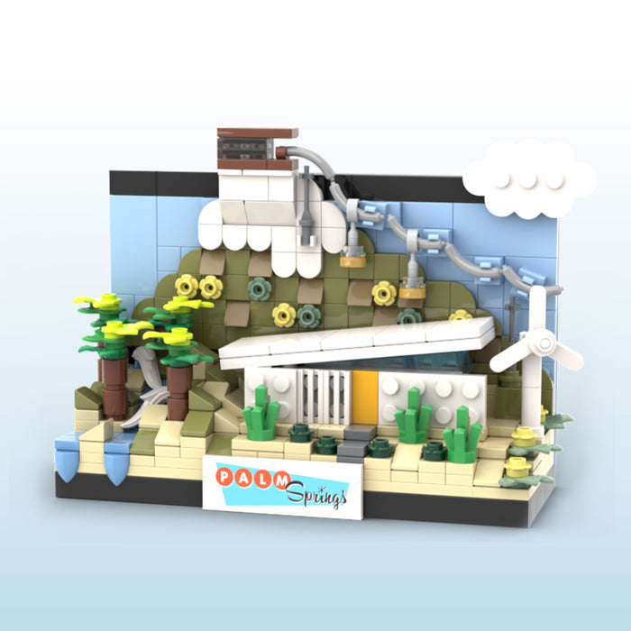 LEGO model of a building with palm trees and 'Palm Springs' sign on a light blue background