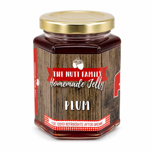 Jar of plum jelly with a wooden-textured label on a white background