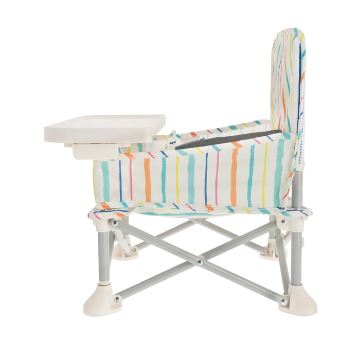 The Nuby Pop Up Booster Seat | Stripes is a portable, foldable travel seat for young children, featuring a colorful striped fabric, sturdy metal legs with plastic supports, and a white tray for convenience.