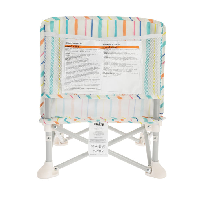 The Nuby Pop Up Booster Seat | Stripes features colorful stripes, white legs, mesh sides, safety and warning labels on the backrest, and a product information tag hanging below the seat.