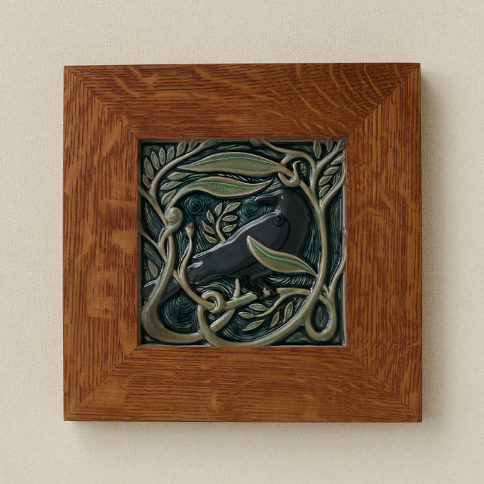 Rookwood Serviceberry Rook revival bird art tile in a golden oak wood frame