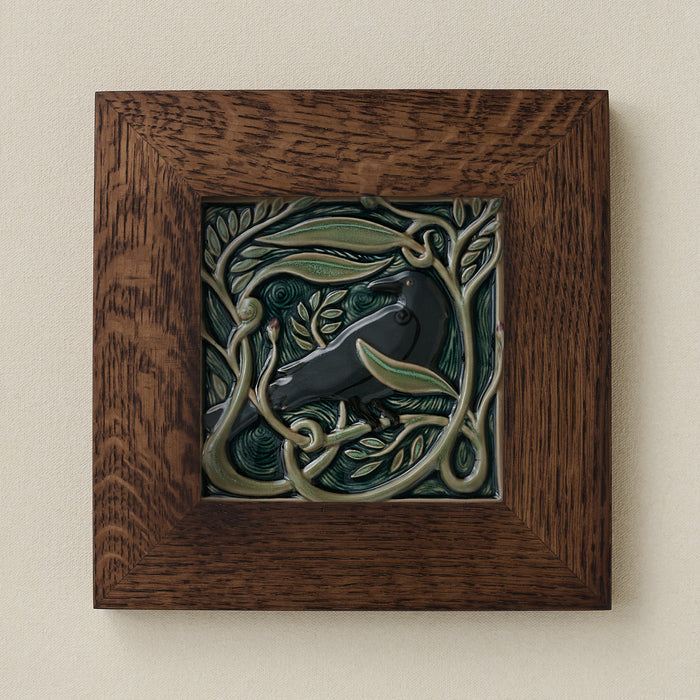 Rookwood Serviceberry Rook revival bird art tile in a dark walnut wood frame