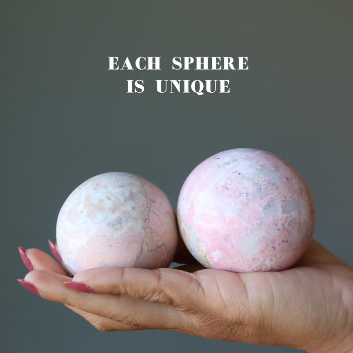 two pink rhodonite spheres