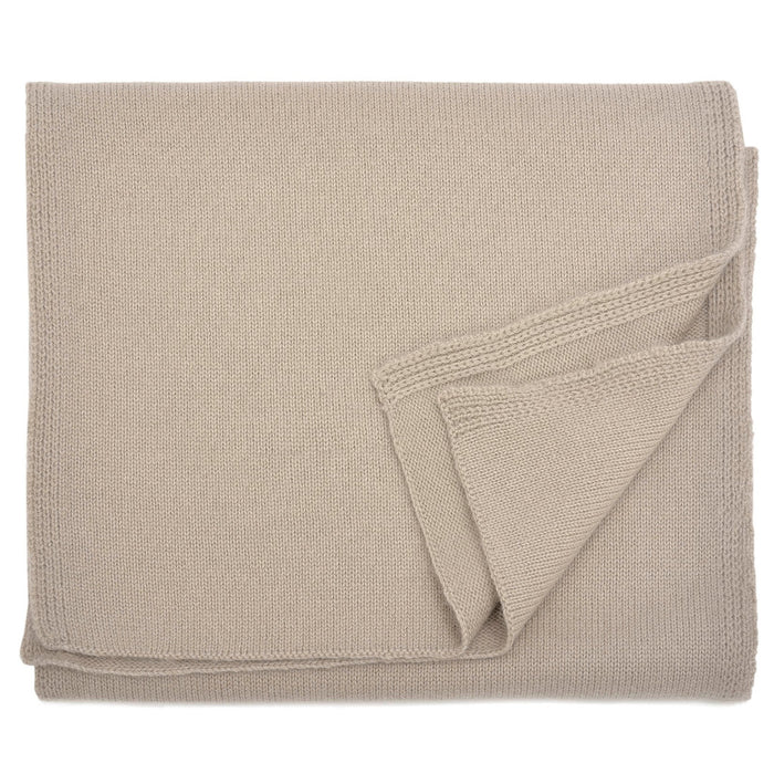 A beige cashmere scarf draped elegantly with a focus on its texture.